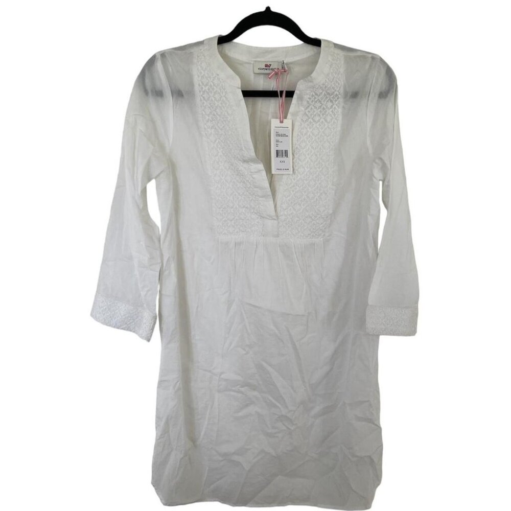 White flowy dress with lace detailing and 3/4 sleeves